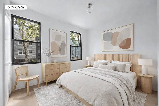 a living room with furniture wooden floor and a flat screen tv