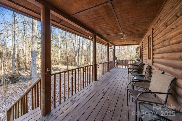 a view of a balcony with chairs