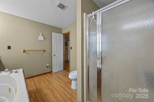 a bathroom with a tub and shower