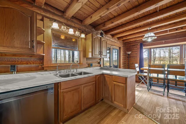 a kitchen with lots of counter top space and dining table