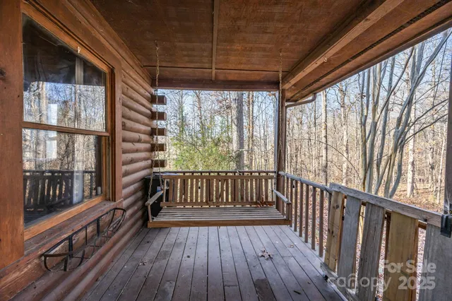 a view of porch with wooden floor
