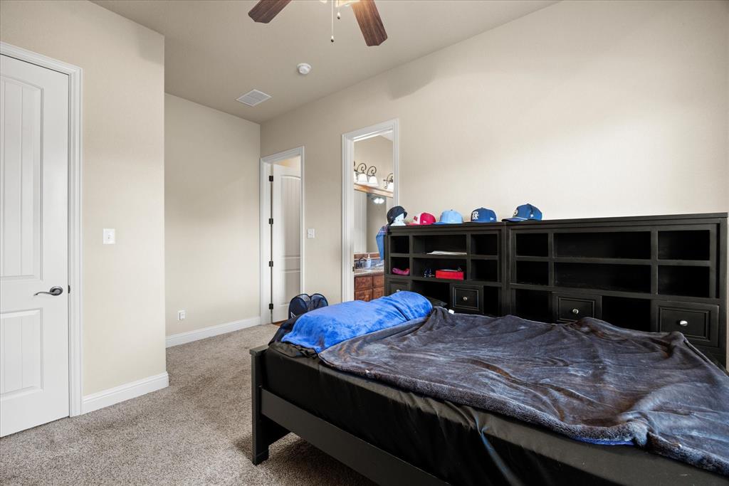 104 Rattling Antler Court Azle, TX 76020 - Photo 17 of 38 One of three secondary bedrooms.