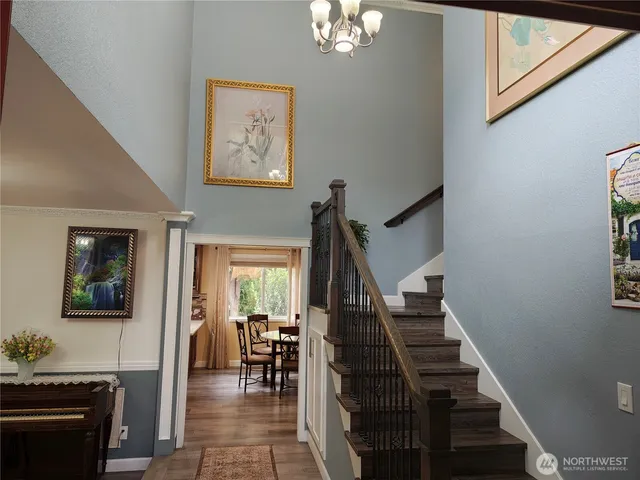 a view of a livingroom with furniture and stairs