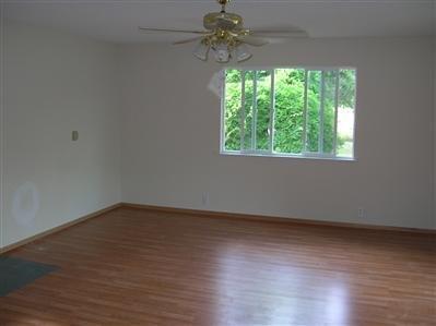 644 Upper River Road Central Point, OR 97502 - Photo 8 of 10 a view of a room with wooden floor and a window