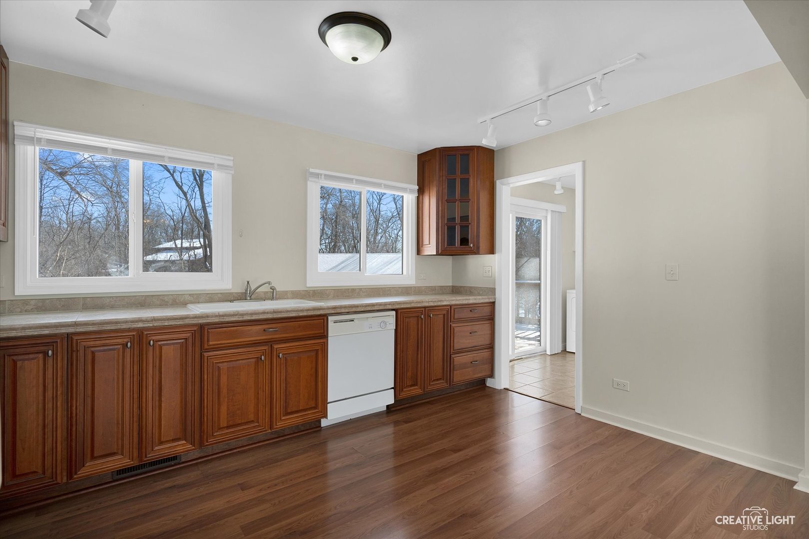 5S621 Radcliff Road Naperville, IL 60563 - Photo 12 of 27 a open kitchen with granite countertop a white stove top oven and sink