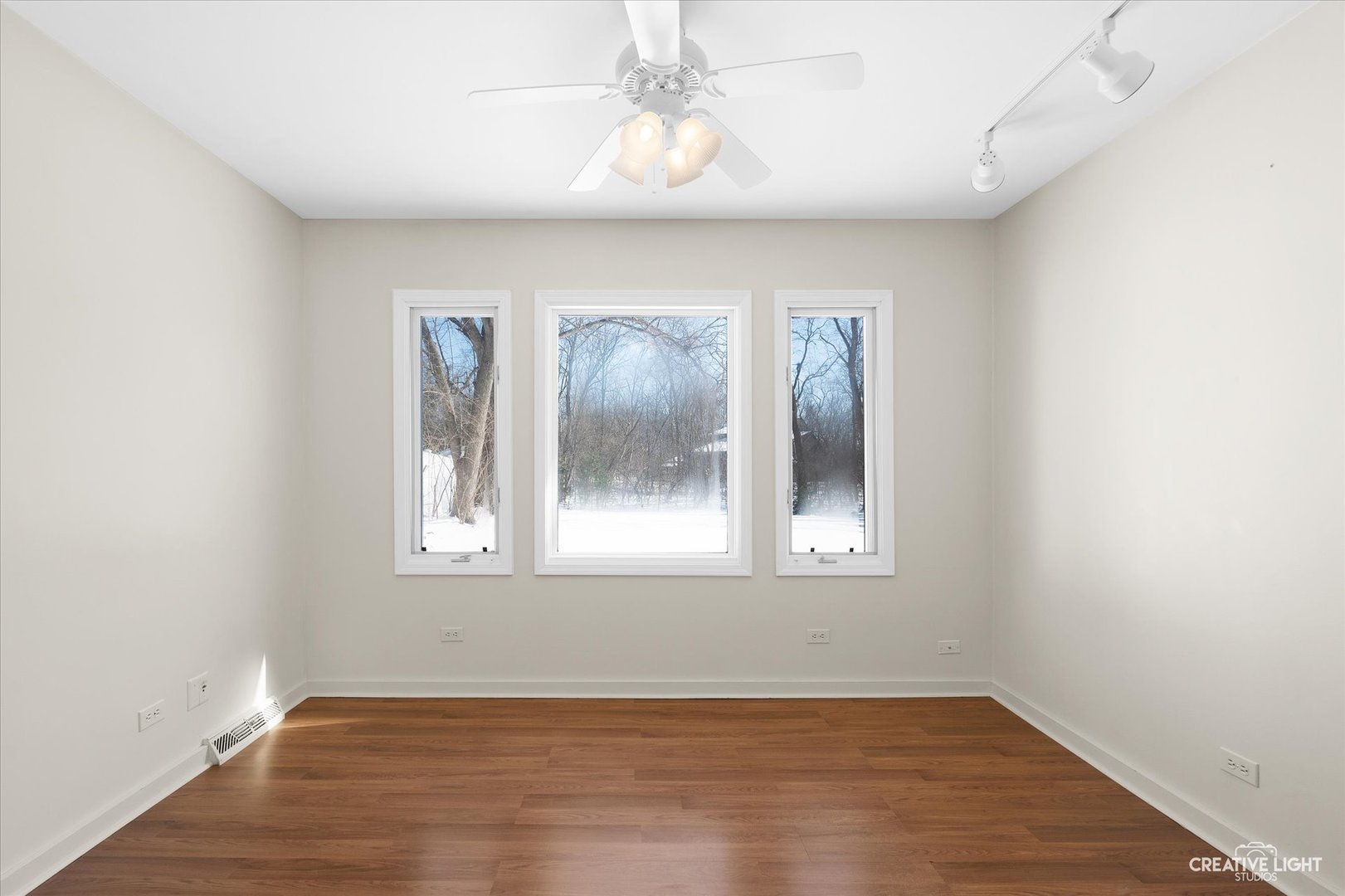 5S621 Radcliff Road Naperville, IL 60563 - Photo 14 of 27 an empty room with wooden floor and windows