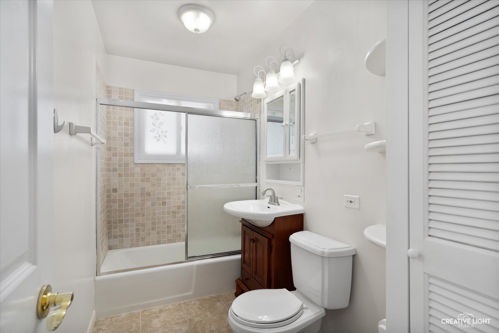 5S621 Radcliff Road Naperville, IL 60563 - Photo 17 of 27 a bathroom with a toilet a sink and shower