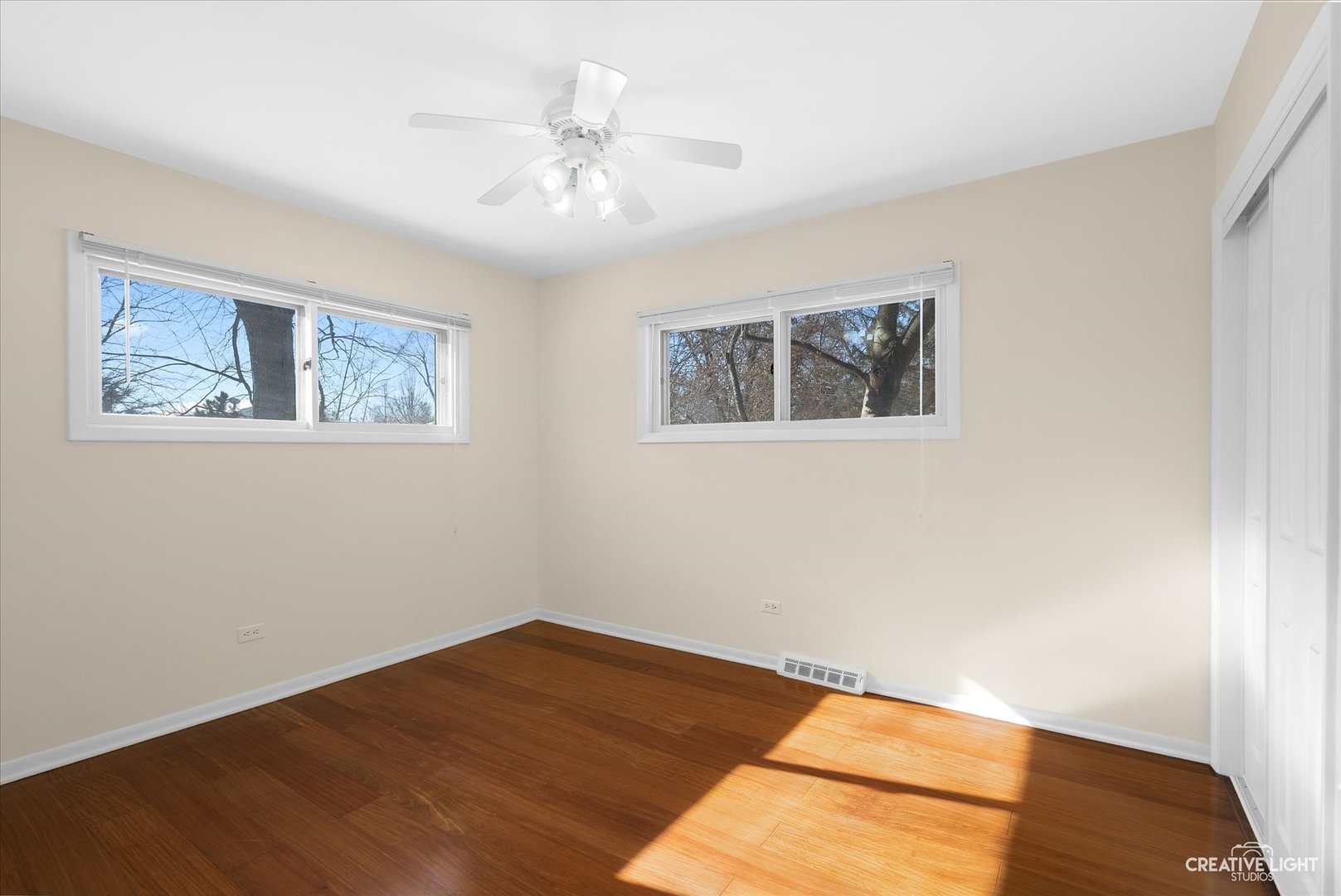 5S621 Radcliff Road Naperville, IL 60563 - Photo 18 of 27 a view of an empty room with wooden floor
