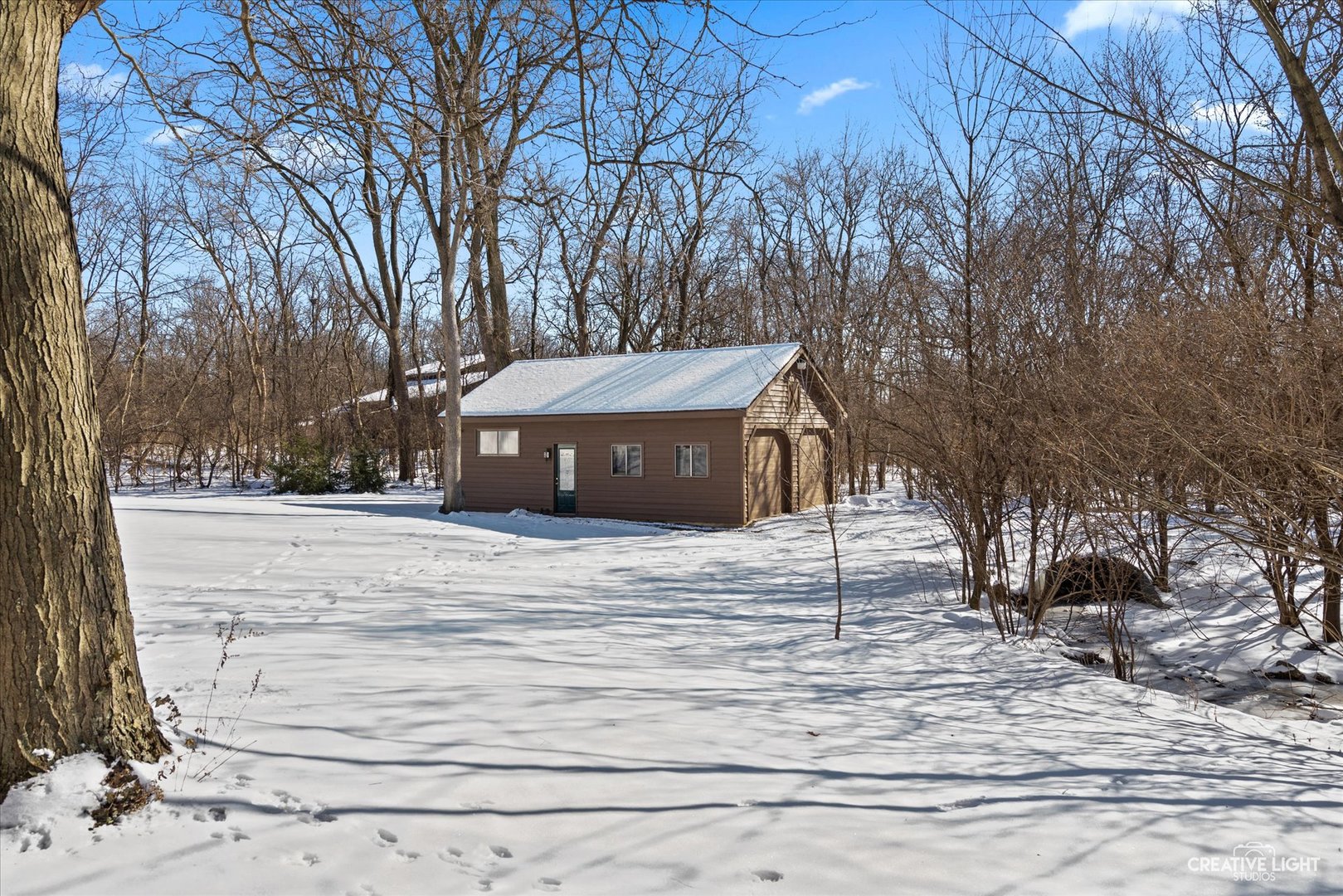 5S621 Radcliff Road Naperville, IL 60563 - Photo 20 of 27 a house with trees in front of it