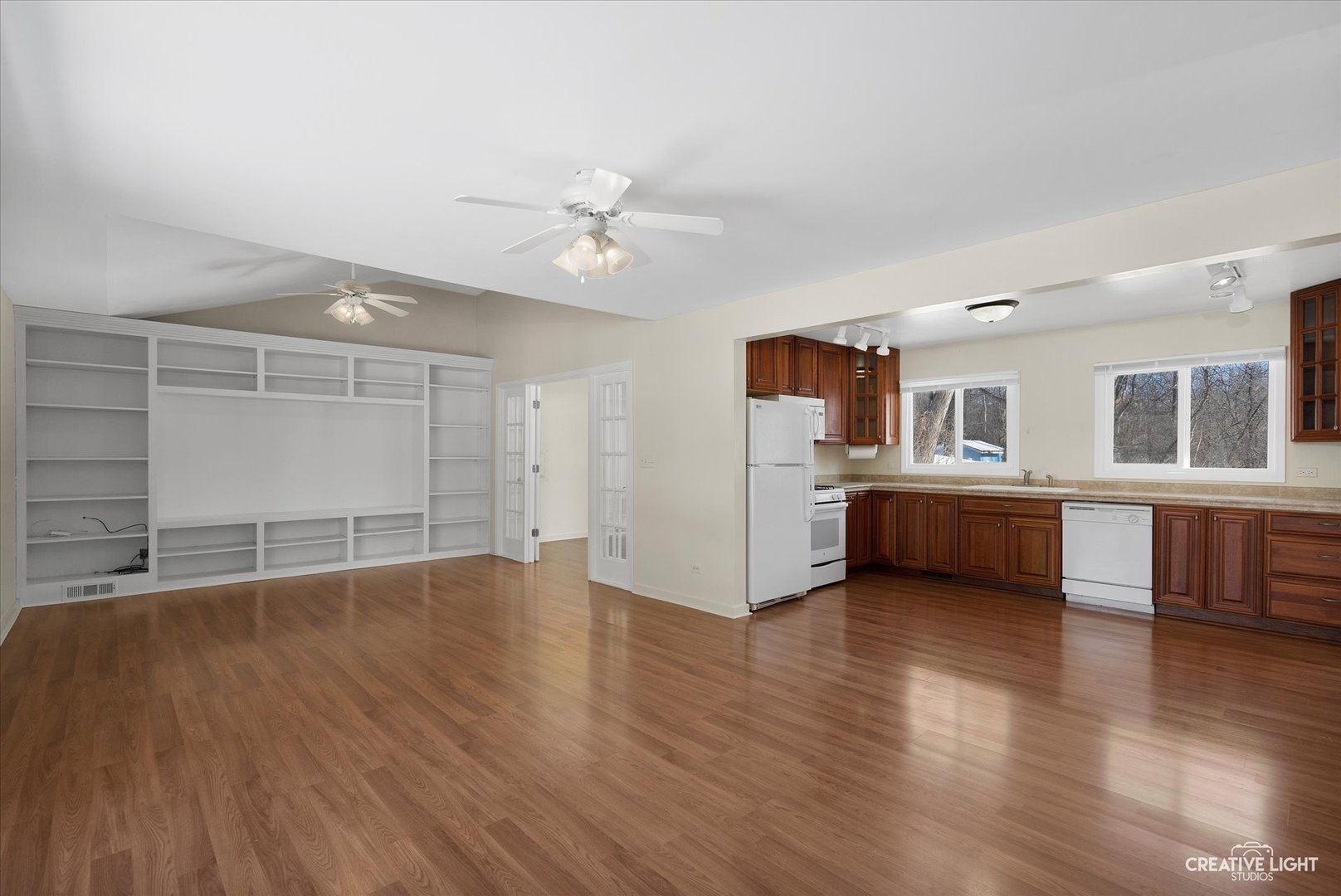 5S621 Radcliff Road Naperville, IL 60563 - Photo 7 of 27 a view of an empty room with a window and wooden floor