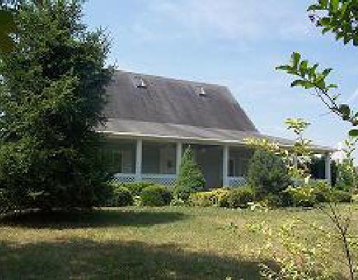 1660 Rock Spring Road Goodview, VA 24095 - Photo 1 of 1 a front view of house with yard and green space