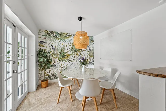 a kitchen with stainless steel appliances kitchen island granite countertop a sink and cabinets