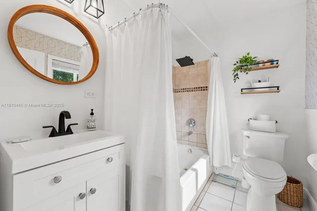 a living room with stainless steel appliances granite countertop furniture and a window