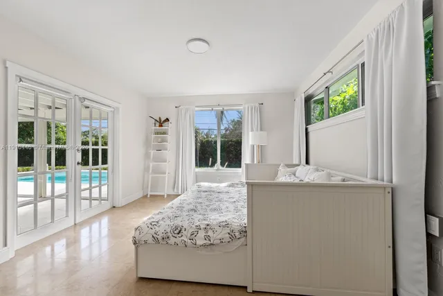 a bathroom with a shower and a curtain