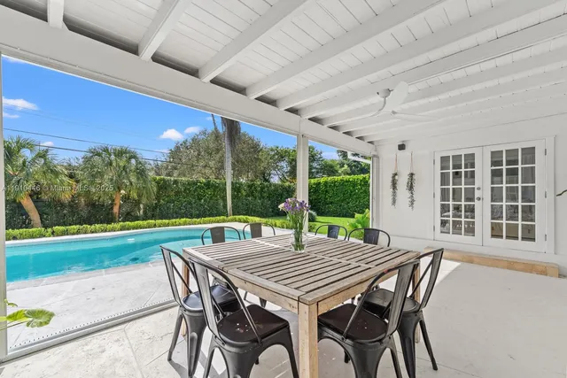 a front view of a house with a garden and yard