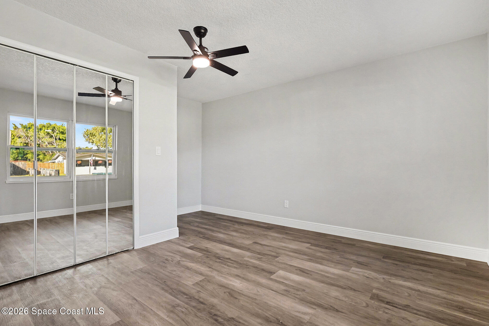 2793 North Breeze Road Melbourne, FL 32935 - Photo 13 of 14 wooden floor in an empty room