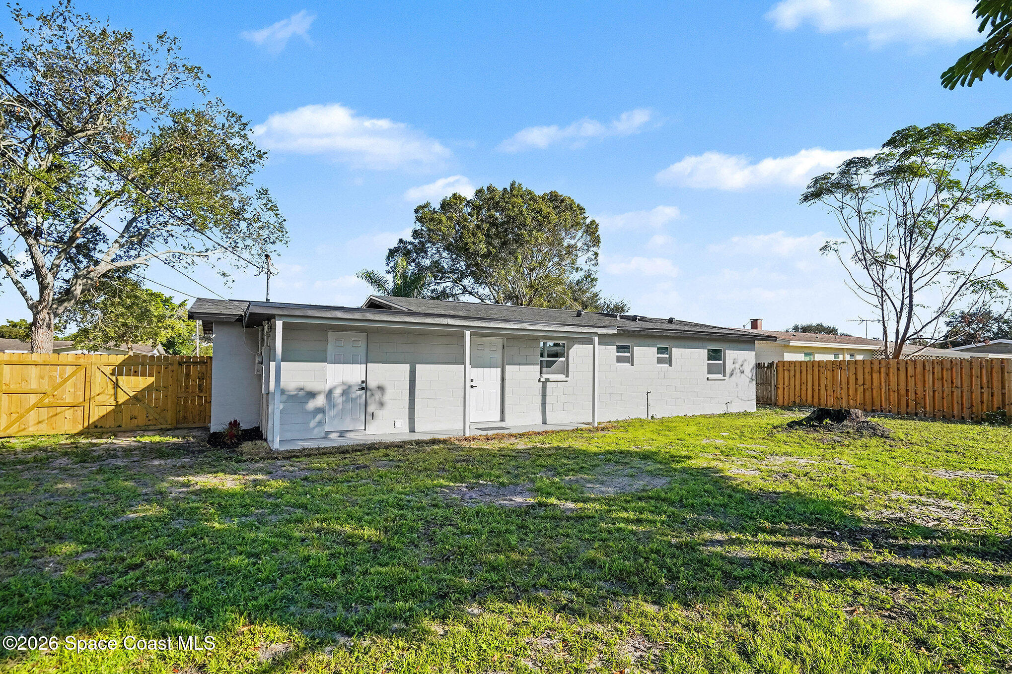 2793 North Breeze Road Melbourne, FL 32935 - Photo 2 of 14 a view of a house with a yard