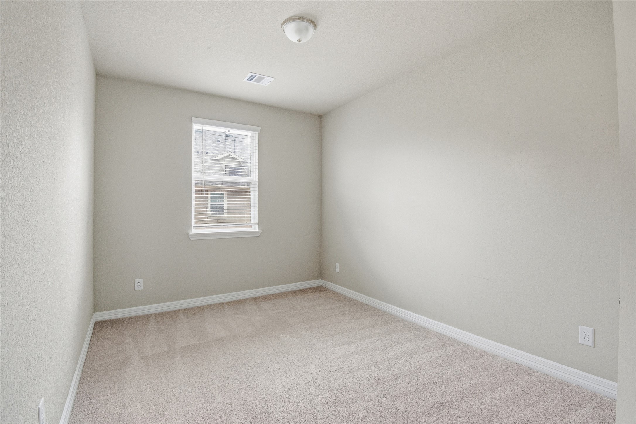 9406 Caddo Ridge Lane Cypress, TX 77433 - Photo 14 of 16 an empty room with a window