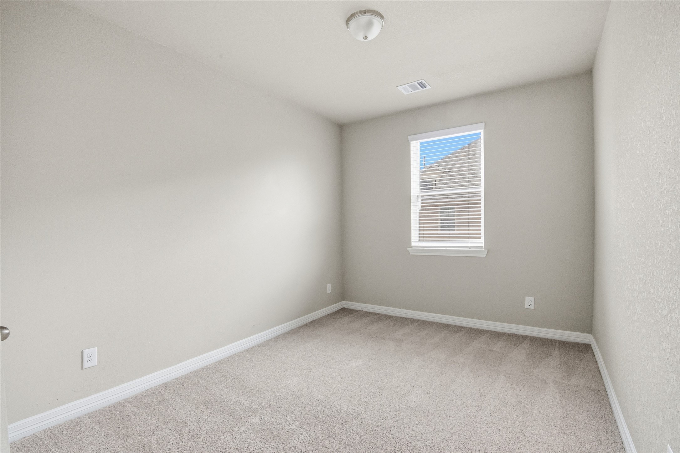 9406 Caddo Ridge Lane Cypress, TX 77433 - Photo 15 of 16 an empty room with a window