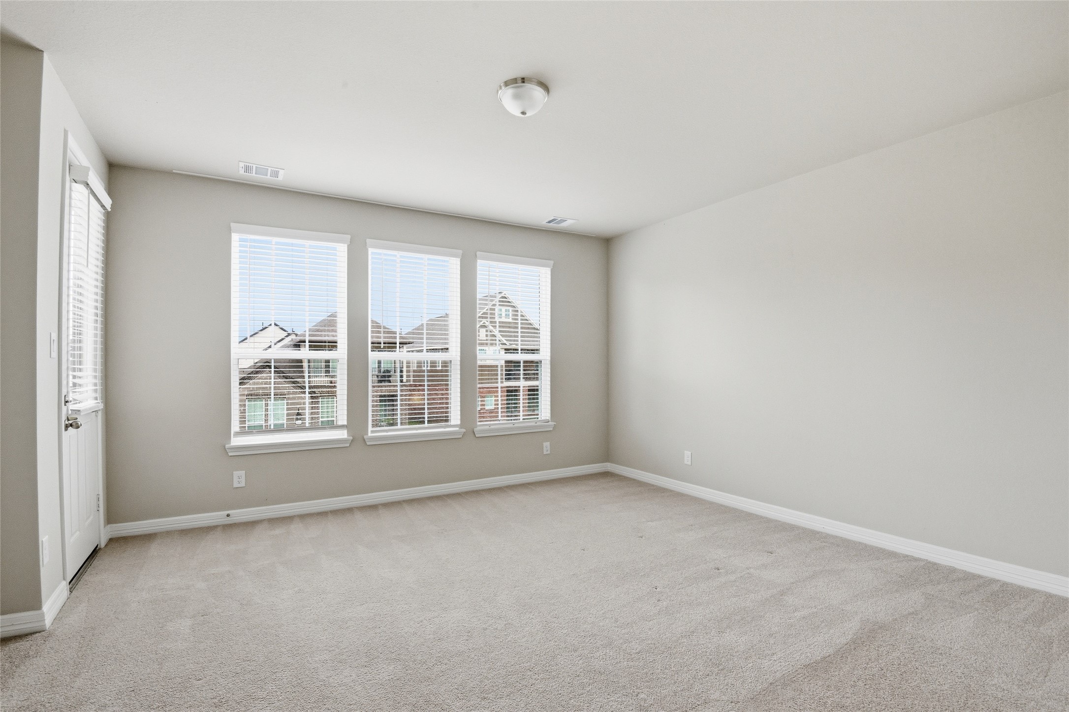 9406 Caddo Ridge Lane Cypress, TX 77433 - Photo 10 of 16 a view of an empty room with a window