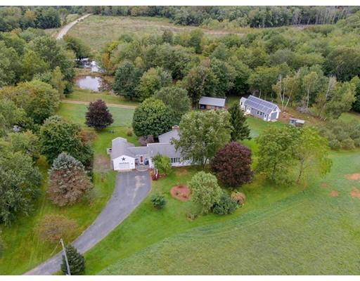 361 Oakham Road New Braintree, MA 01531 - Photo 1 of 30 an aerial view of a house with a yard
