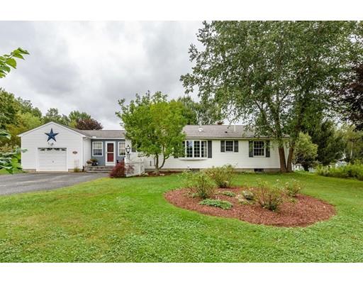 361 Oakham Road New Braintree, MA 01531 - Photo 2 of 30 a front view of a house with a garden and trees