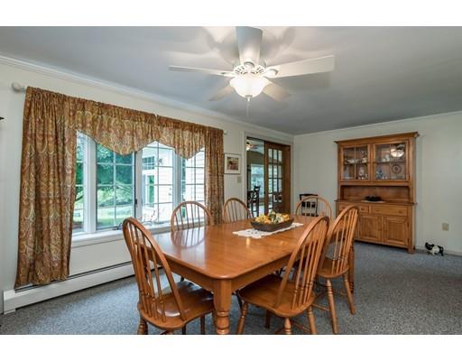 361 Oakham Road New Braintree, MA 01531 - Photo 5 of 30 a dining room with furniture a large window and wooden floor