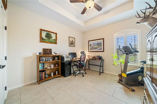 a view of a livingroom with furniture and workspace