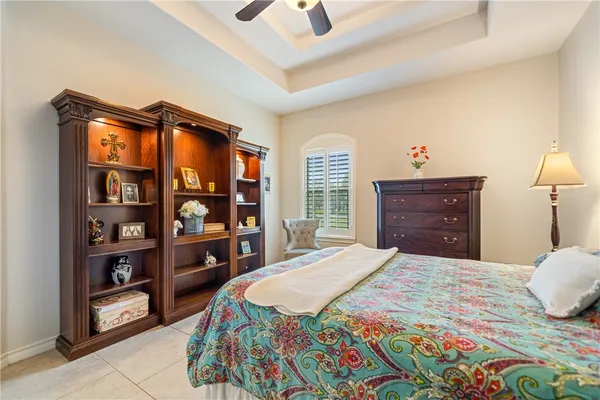 a bedroom with a bed and a cabinets