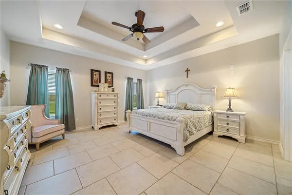 a bedroom with a bed and a view of walk in closet