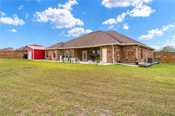 a view of a house with a big yard