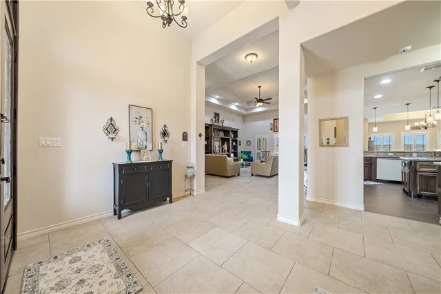 a large kitchen with a table and chairs