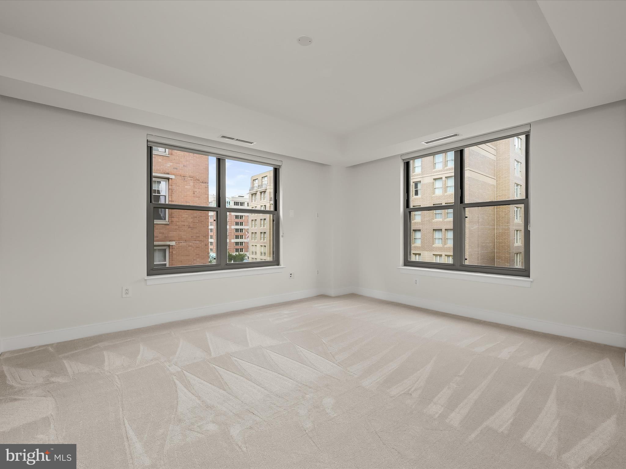 2425 L Street Northwest, Unit 536 Washington, DC 20037 - Photo 15 of 41 an empty room with windows