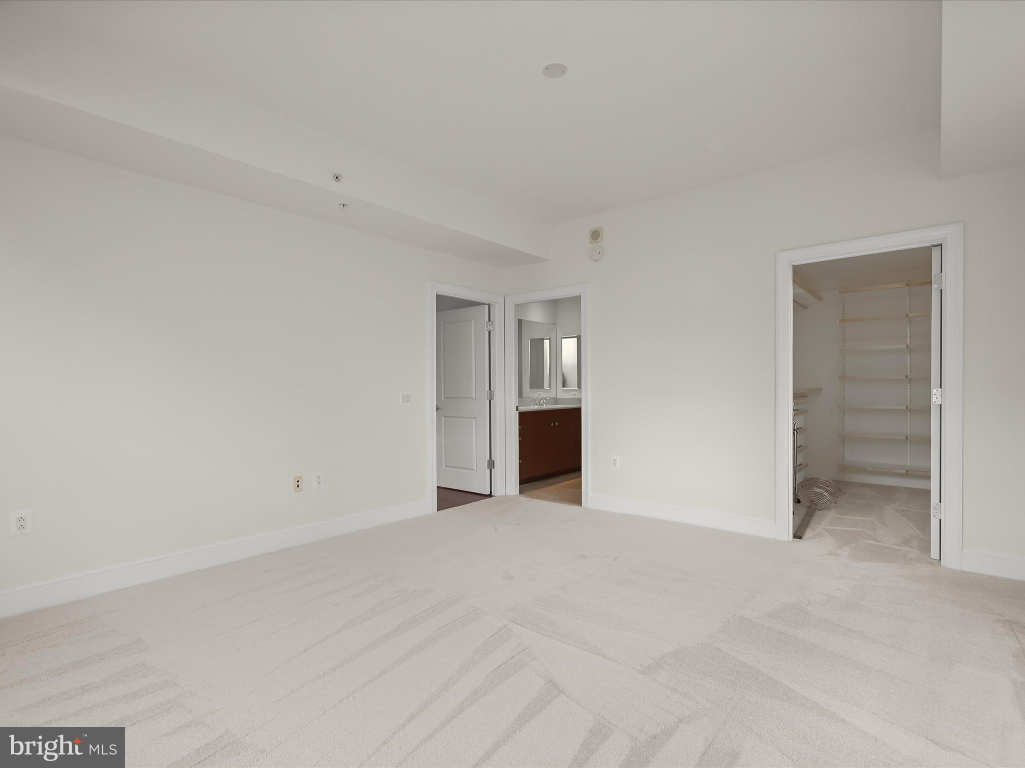 2425 L Street Northwest, Unit 536 Washington, DC 20037 - Photo 16 of 41 a view of an empty room with a closet