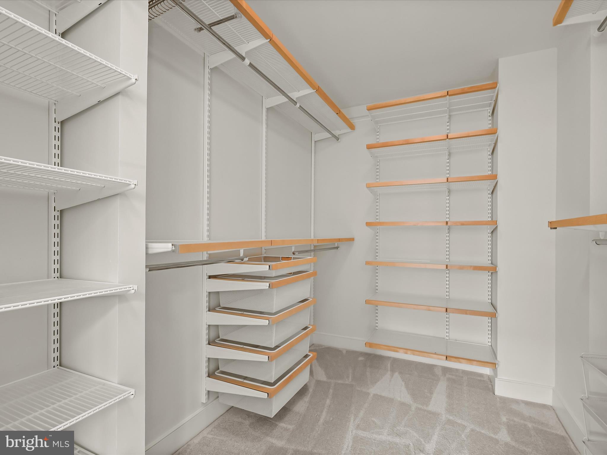 2425 L Street Northwest, Unit 536 Washington, DC 20037 - Photo 17 of 41 a view of walk in closet with empty racks