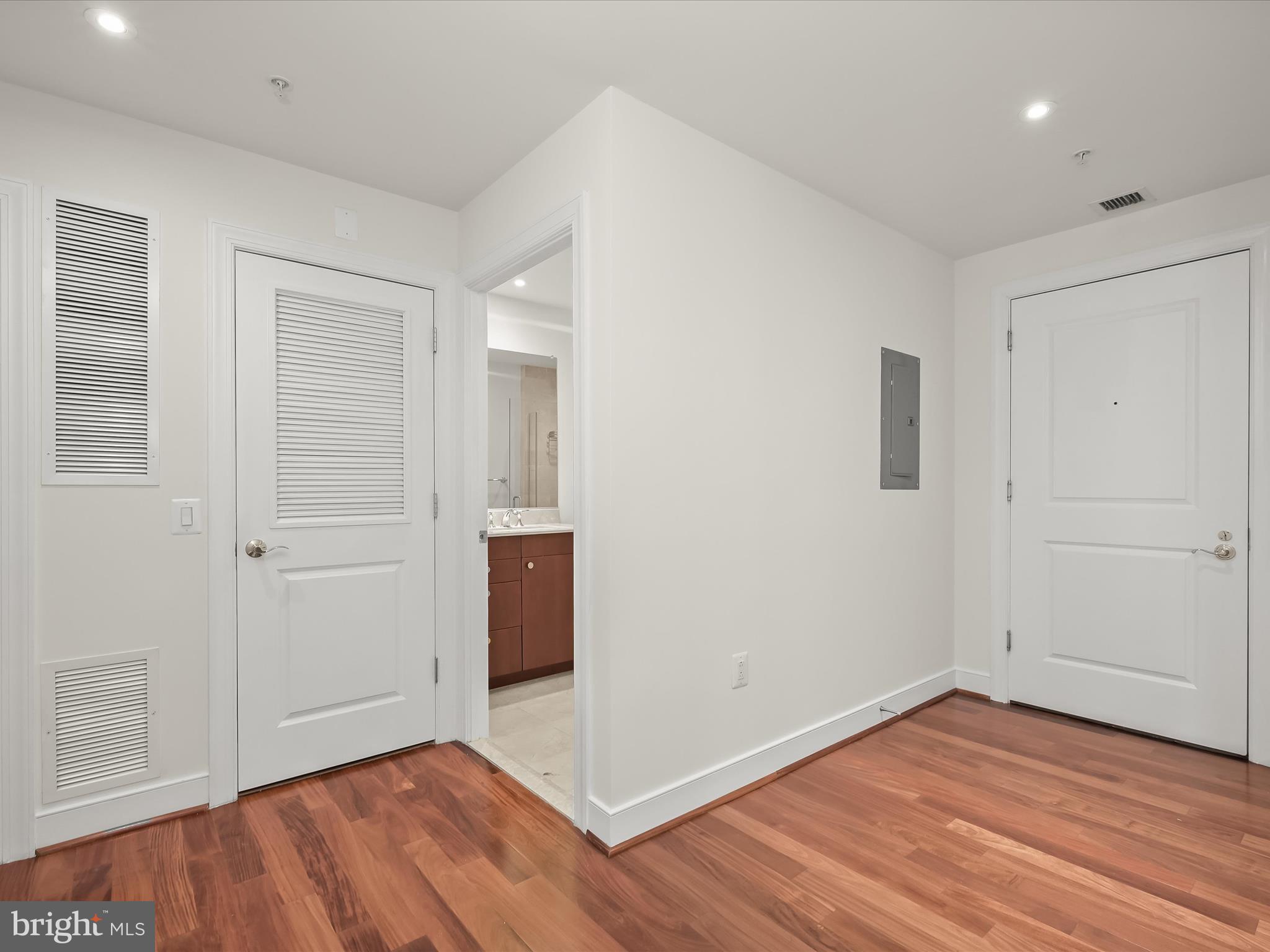 2425 L Street Northwest, Unit 536 Washington, DC 20037 - Photo 23 of 41 an empty room with wooden floor