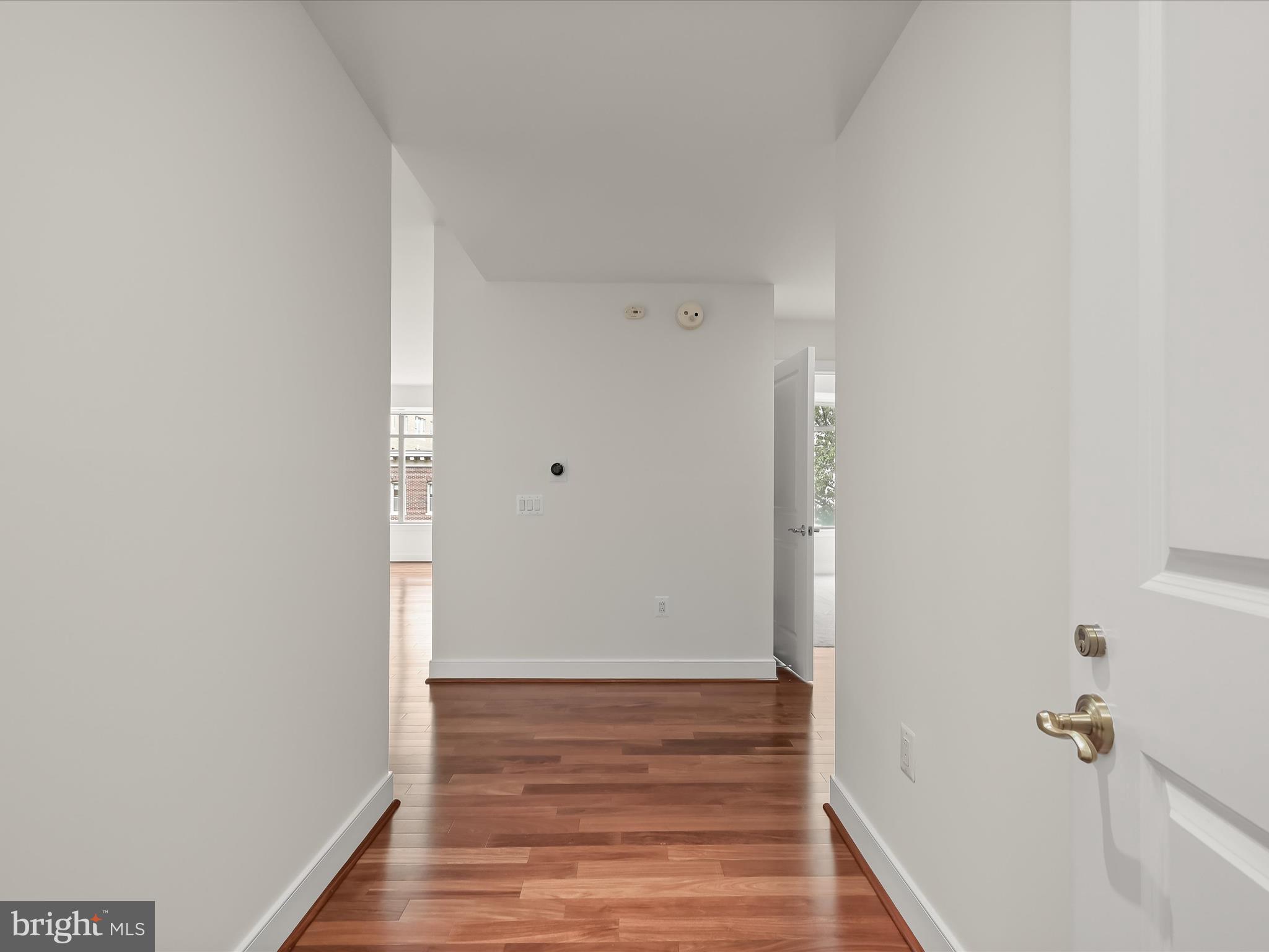 2425 L Street Northwest, Unit 536 Washington, DC 20037 - Photo 4 of 41 a view of a hallway with wooden floor