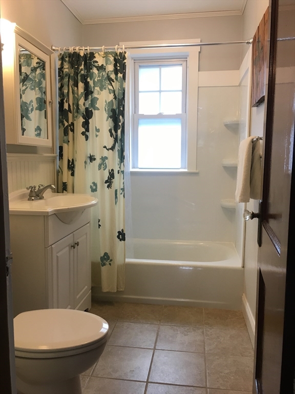 7 Richie Road, Unit 2 Quincy, MA 02169 - Photo 7 of 7 a bathroom with a sink a toilet and a bathtub