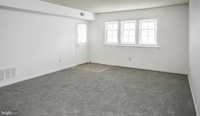 an empty room with windows