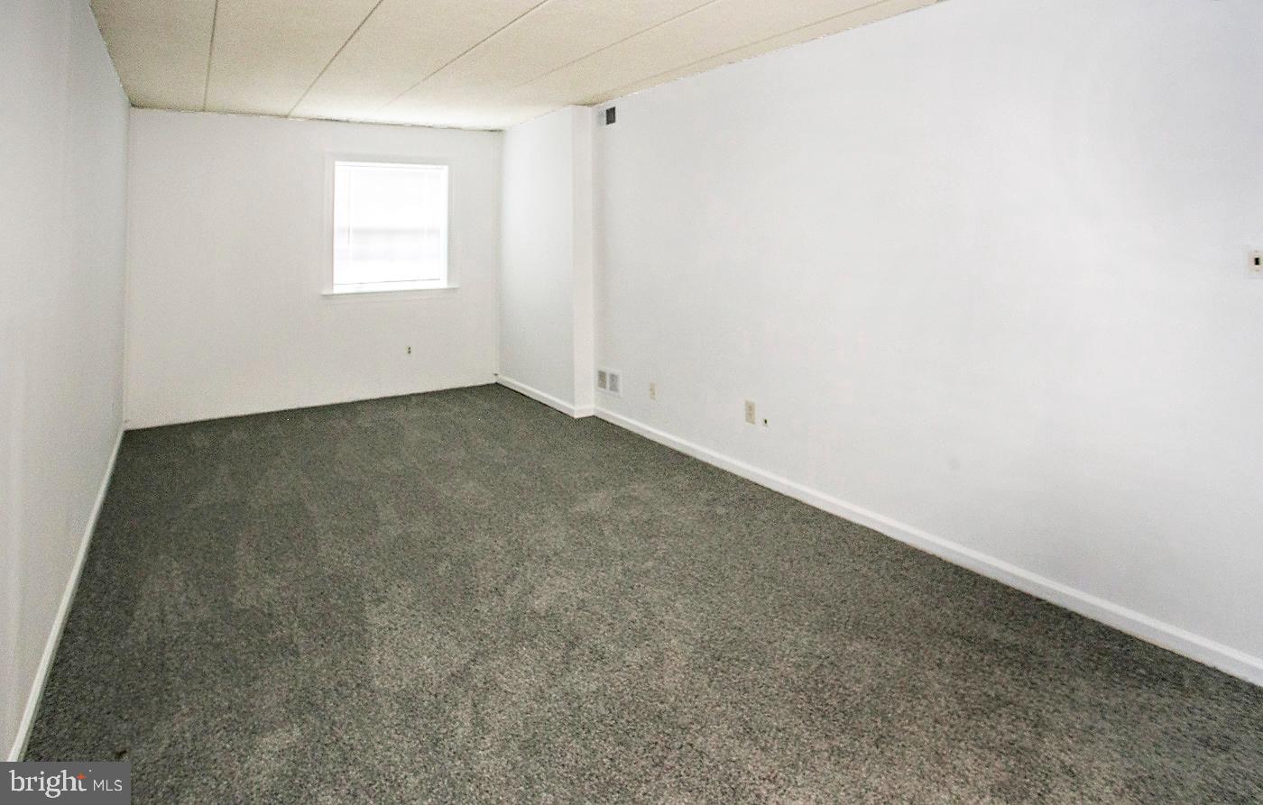 154 Woodstream Drive, Unit CONDO 154 Jeffersonville, PA 19403 - Photo 29 of 34 an empty room with a window