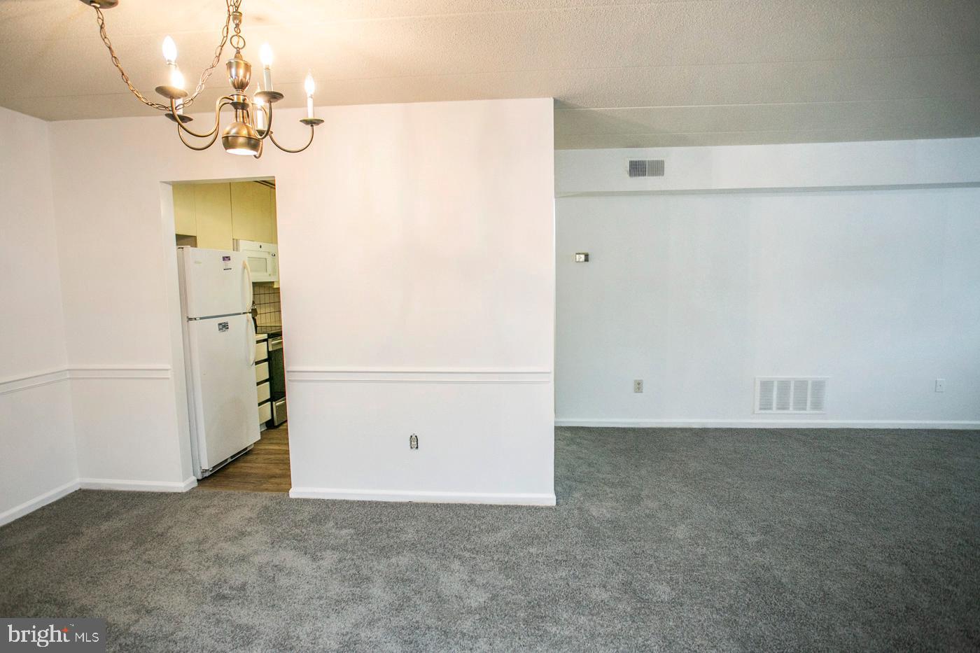 154 Woodstream Drive, Unit CONDO 154 Jeffersonville, PA 19403 - Photo 34 of 34 a view of a chandelier in big room