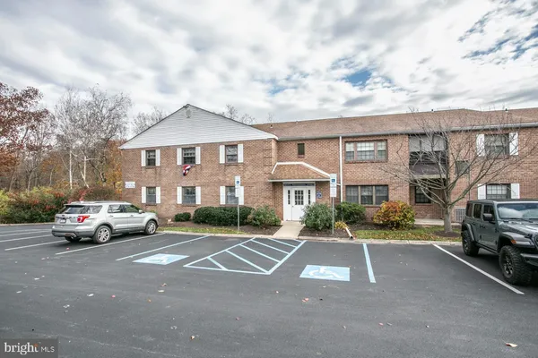 a view of street with parked cars