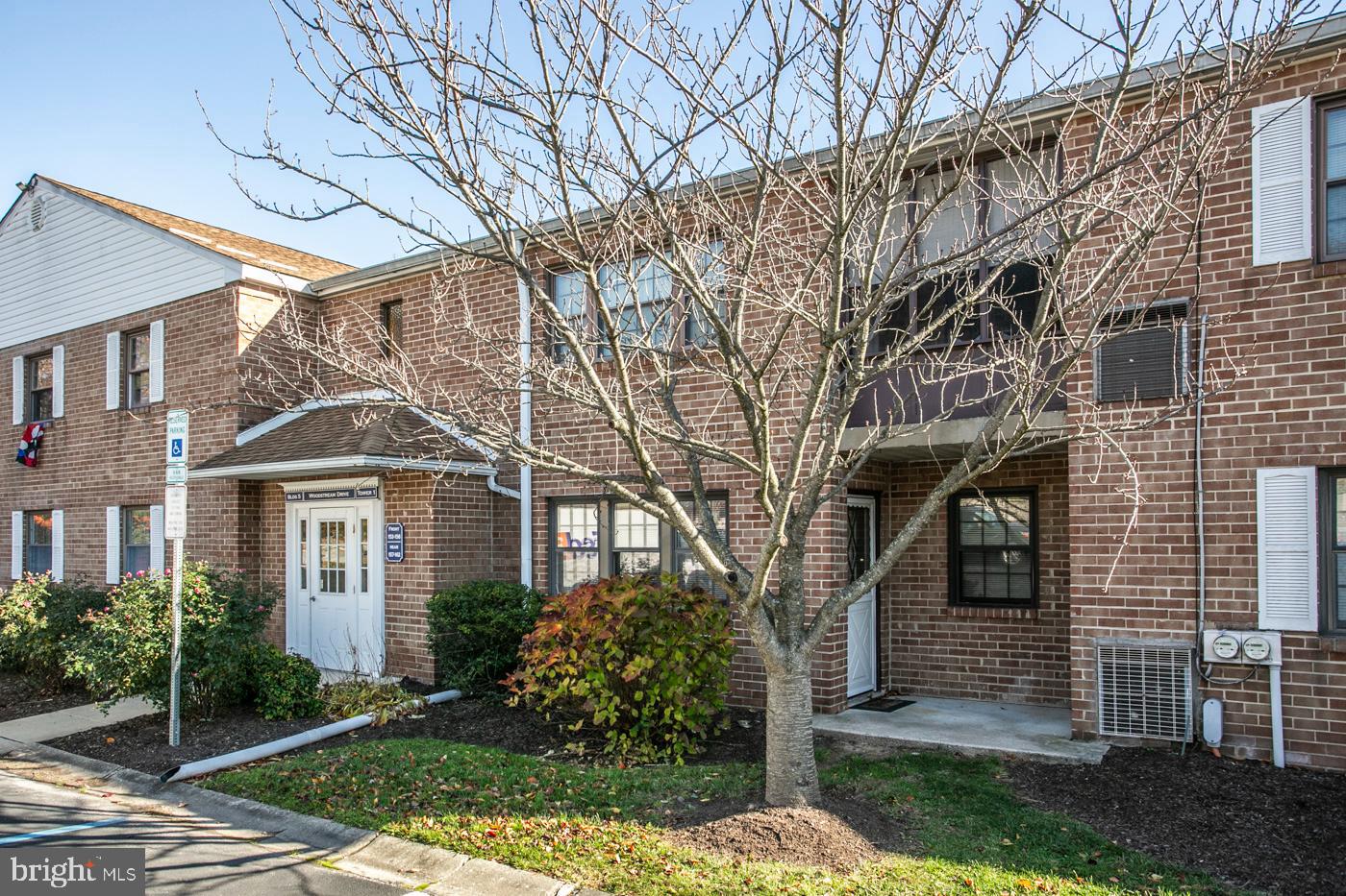 154 Woodstream Drive, Unit CONDO 154 Jeffersonville, PA 19403 - Photo 9 of 34 a front view of a house with garden