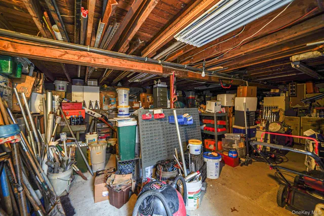 a view of a white house with wooden fence