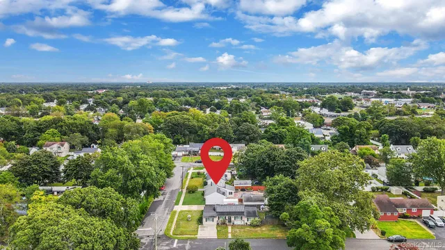 a view of a city with lush green forest