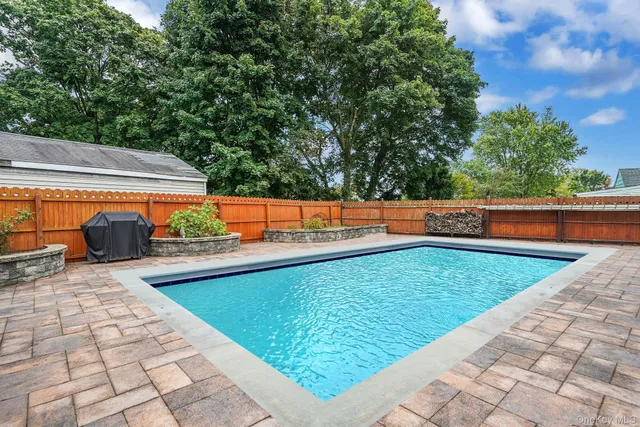 a view of a swimming pool with a lounge chairs