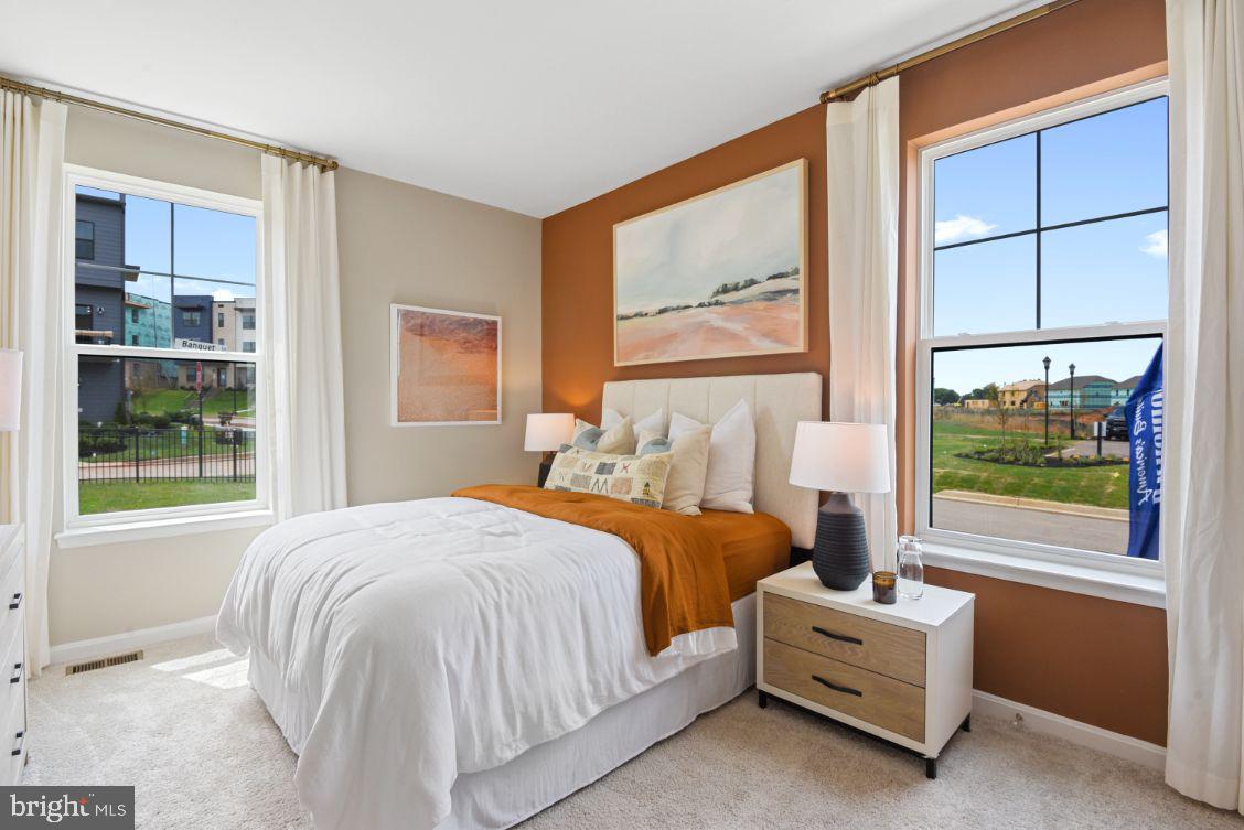 453 Ensemble Way Frederick, MD 21701 - Photo 12 of 34 a bedroom with a bed and a window