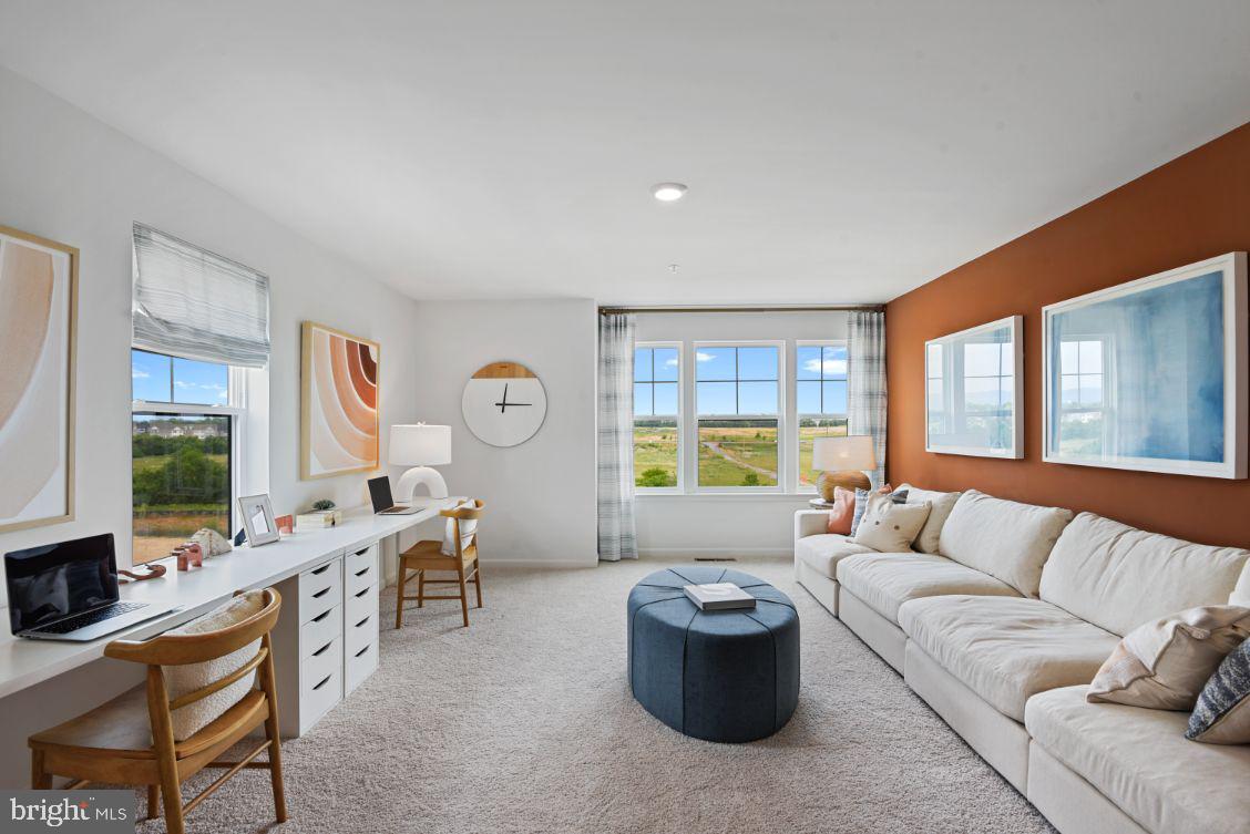 453 Ensemble Way Frederick, MD 21701 - Photo 21 of 34 a living room with furniture and a large window
