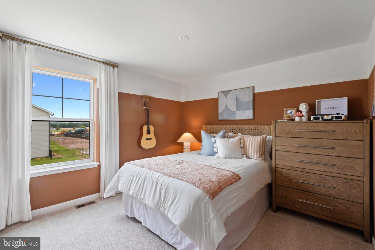 453 Ensemble Way Frederick, MD 21701 - Photo 24 of 34 a bedroom with a bed and a window