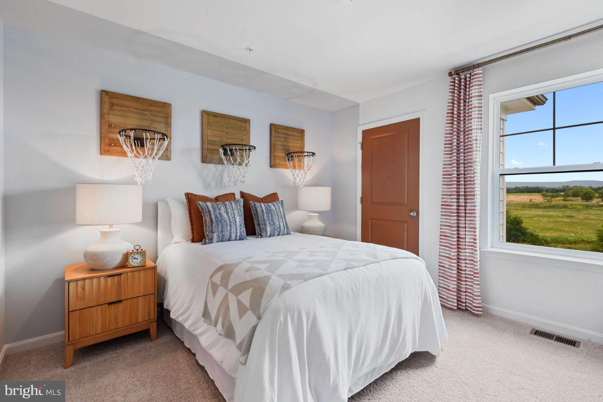 453 Ensemble Way Frederick, MD 21701 - Photo 26 of 34 a bedroom with bed and window